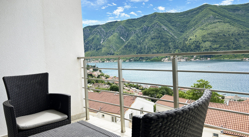 Apartment with a view of the Bay of Kotor in a complex with a swimming pool